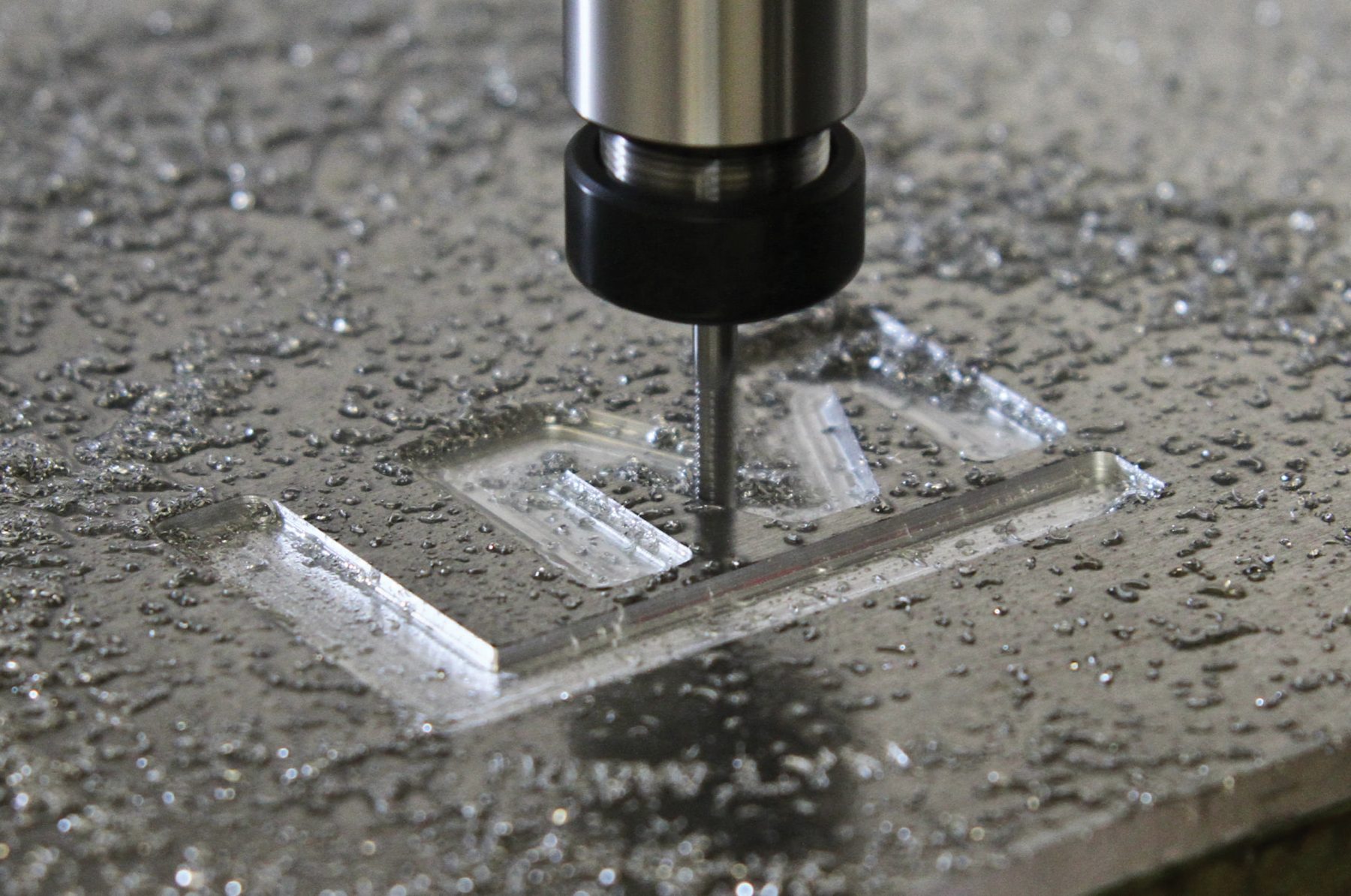 CNC machine carving into metal